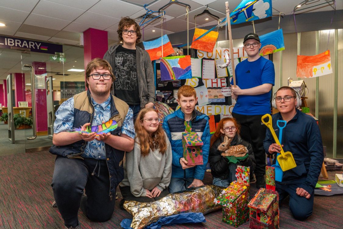 Picture of foundation learning students with summer art pieces